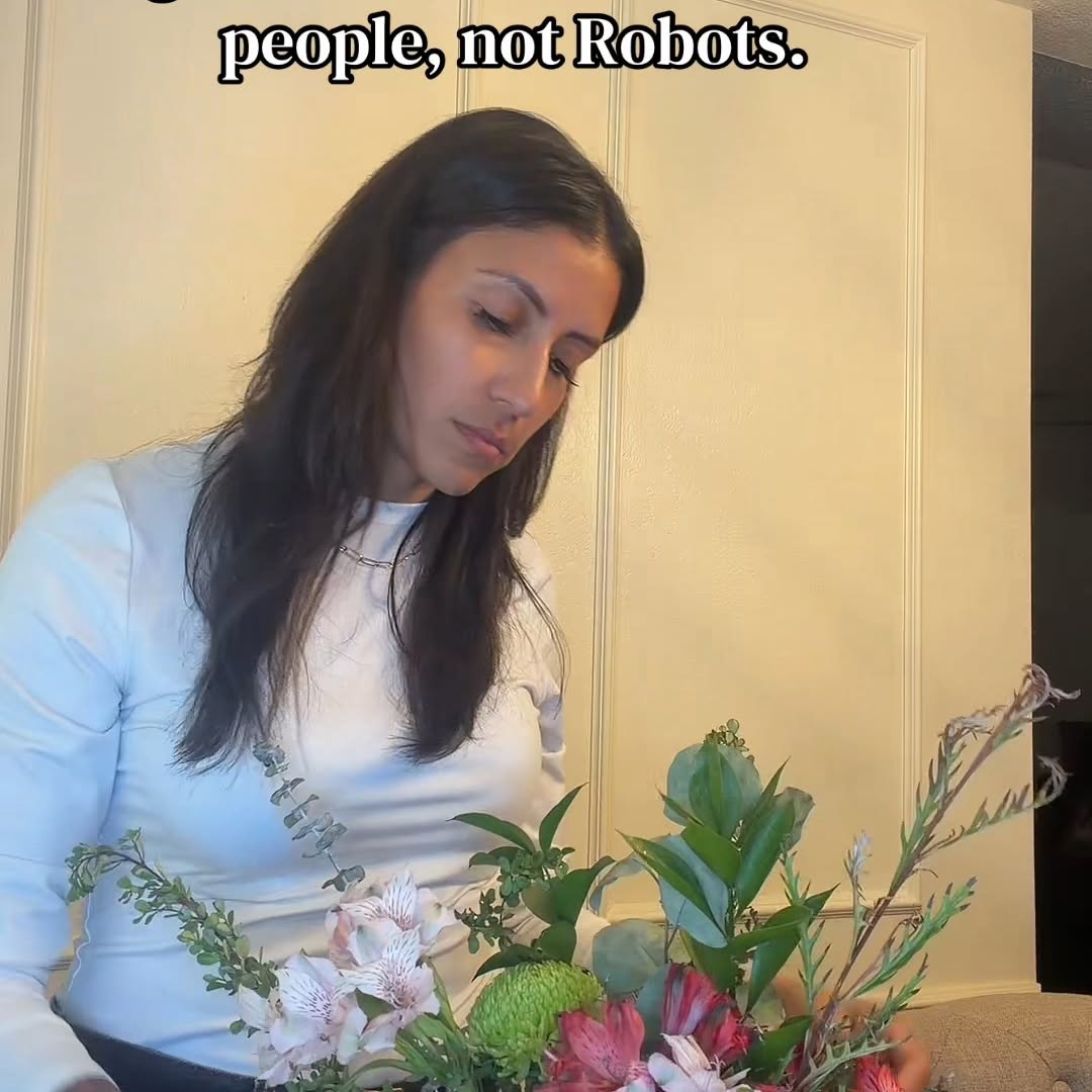 Flower arranging takes a gentle touch. Robots? Not exactly known for that.

Just another reason why people are the best.